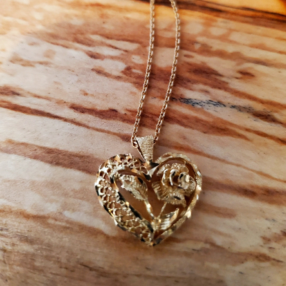 14k gold rose necklace. (See photos for stamps)